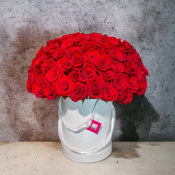 Large bouquet of red roses in a white hat box