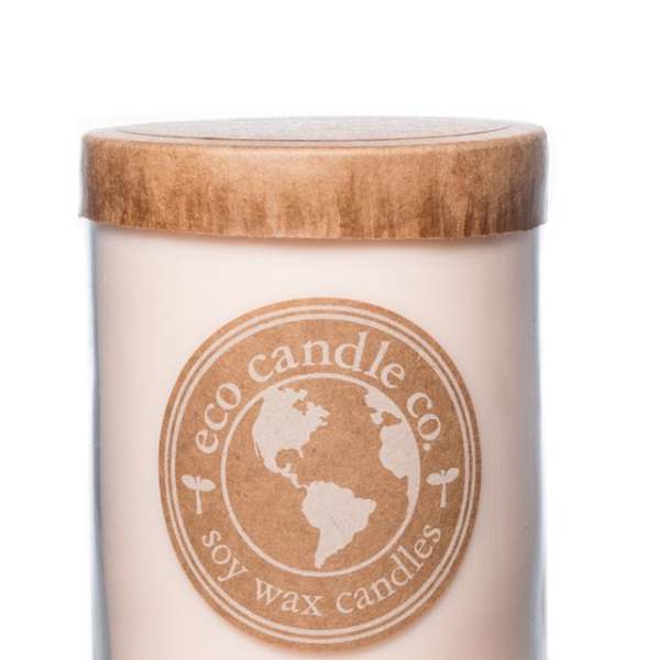 Soy wax candle in a glass jar with a wooden lid