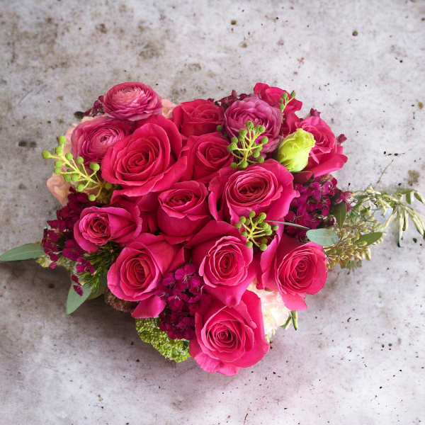 Hot pink rose bouquet with small accent flowers