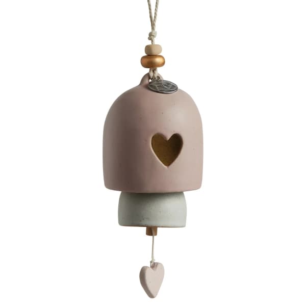Hanging ceramic bell ornament with a heart cutout and bead accents