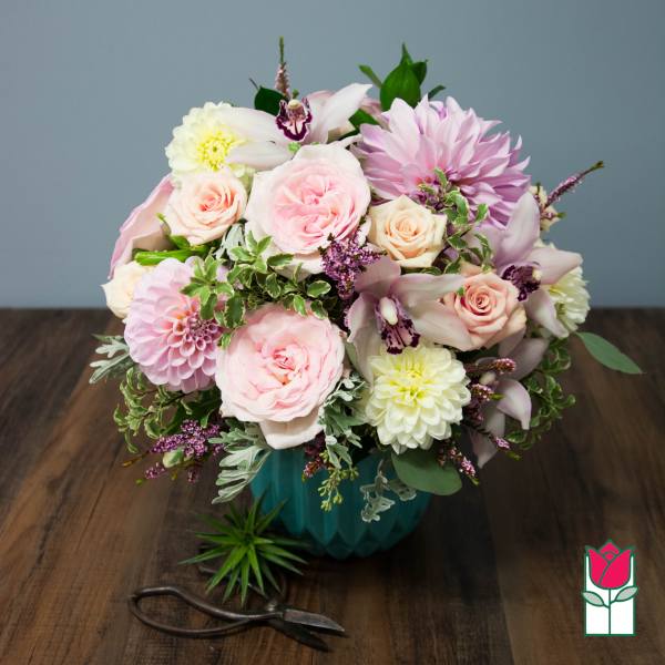 Pink and white mixed bouquet in a teal vase