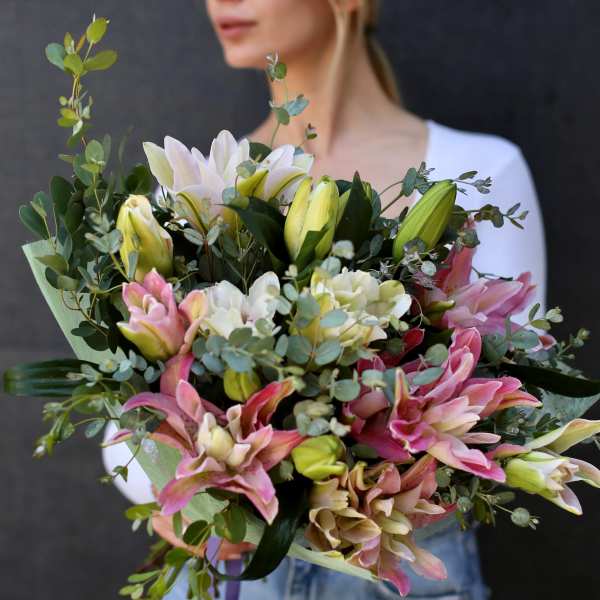 Bouquet of pink and white lilies with eucalyptus greenery