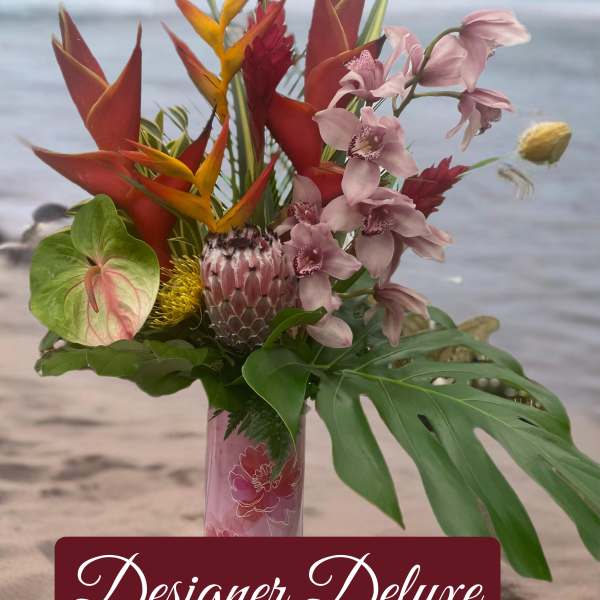 Tropical bouquet in a pink vase with orchids and red-orange heliconia