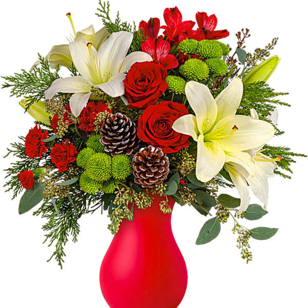 Red and white floral arrangement in a red vase with pinecones