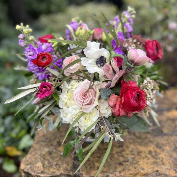 Mixed bouquet with pink, red, white, and purple flowers