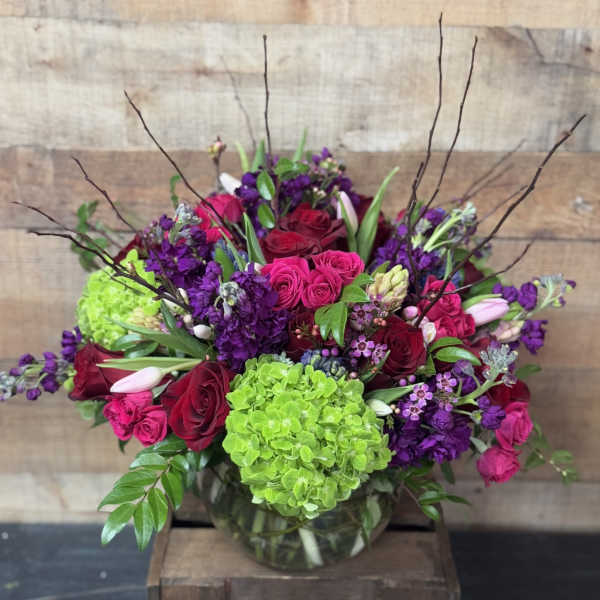 Bouquet of pink and purple flowers in a glass vase