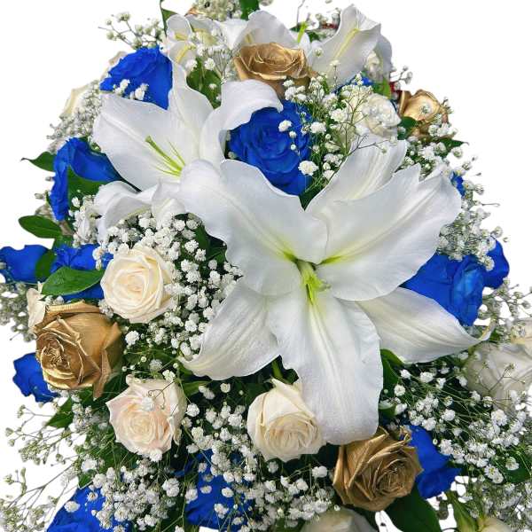 Bouquet of white lilies, blue and gold roses, and baby's breath