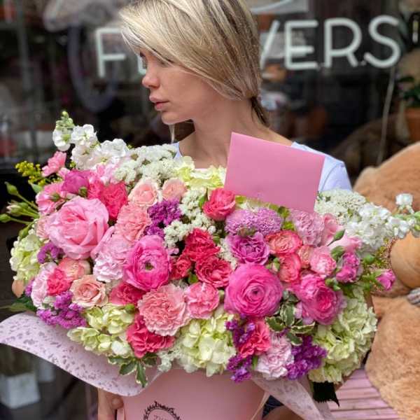 Large pink and white mixed flower bouquet in a pink box