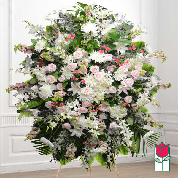 Large standing floral spray with pink roses and white lilies