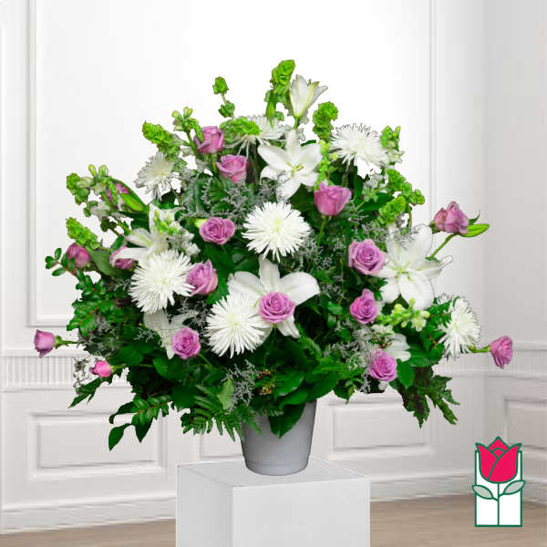 White lilies and pink roses in a gray vase
