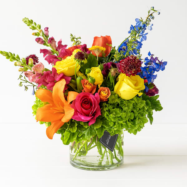 Colorful mixed bouquet in a clear glass vase