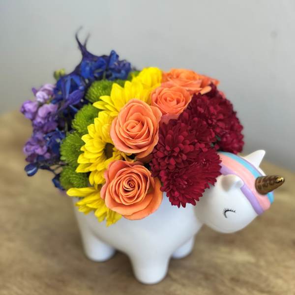Rainbow bouquet in a white unicorn planter