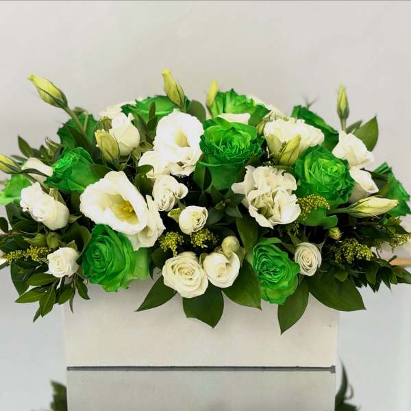 White and bright green roses arranged in a rectangular box