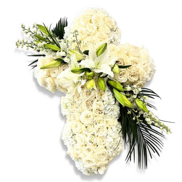 White floral cross arrangement with lilies and roses
