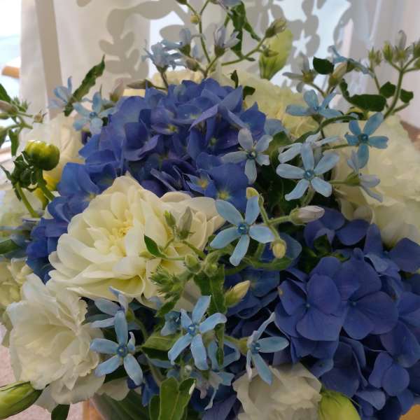 Blue and white flower bouquet in a vase