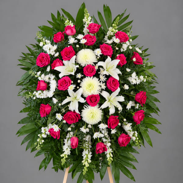 Standing floral spray with pink roses, white lilies, and white chrysanthemums