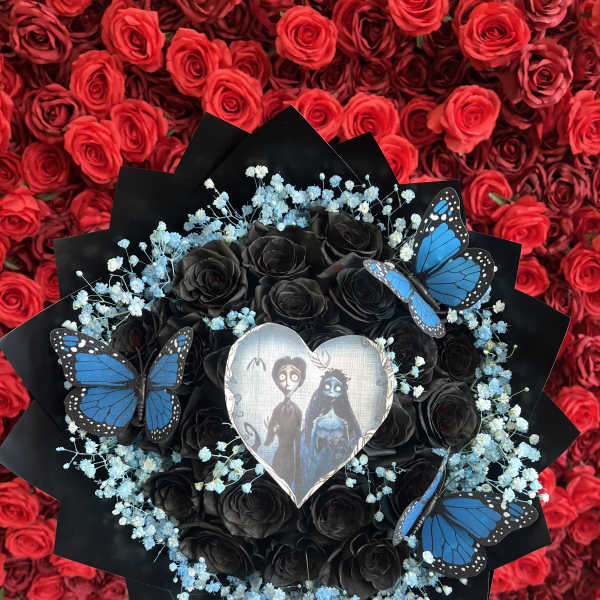 Black rose bouquet with blue baby's breath and butterfly accents