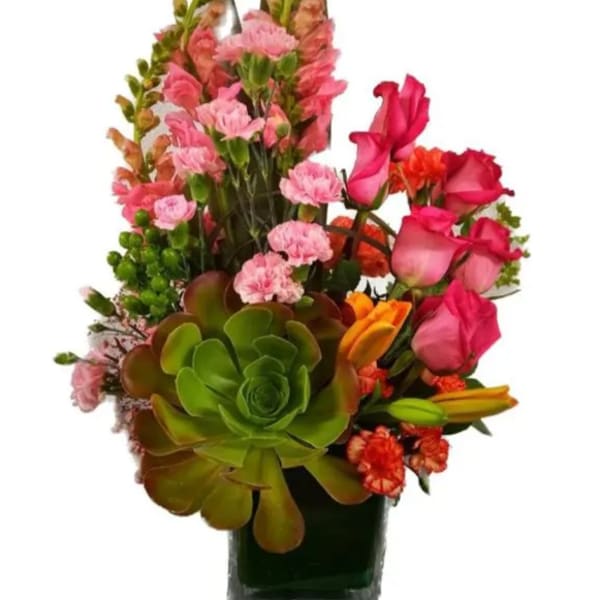 Mixed bouquet with pink roses, carnations, and succulents in a glass vase