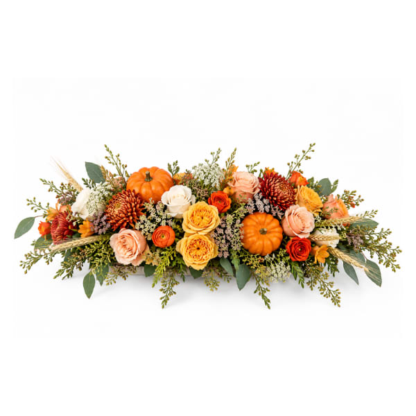 Autumn floral centerpiece with orange pumpkins and mixed roses