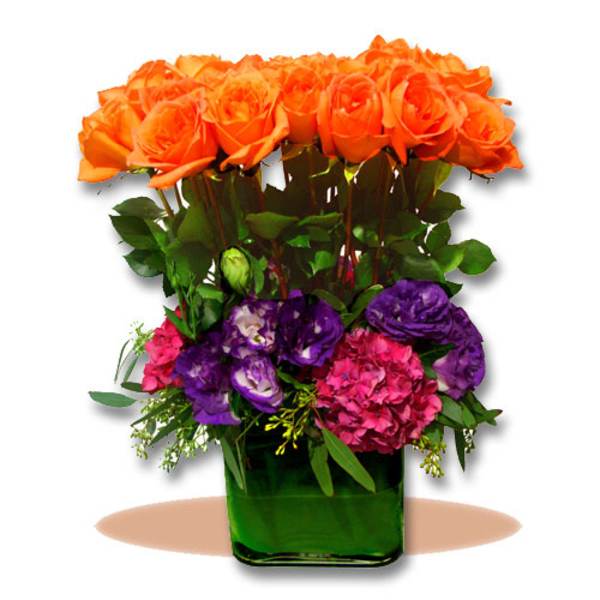 Orange roses and purple flowers in a green glass vase