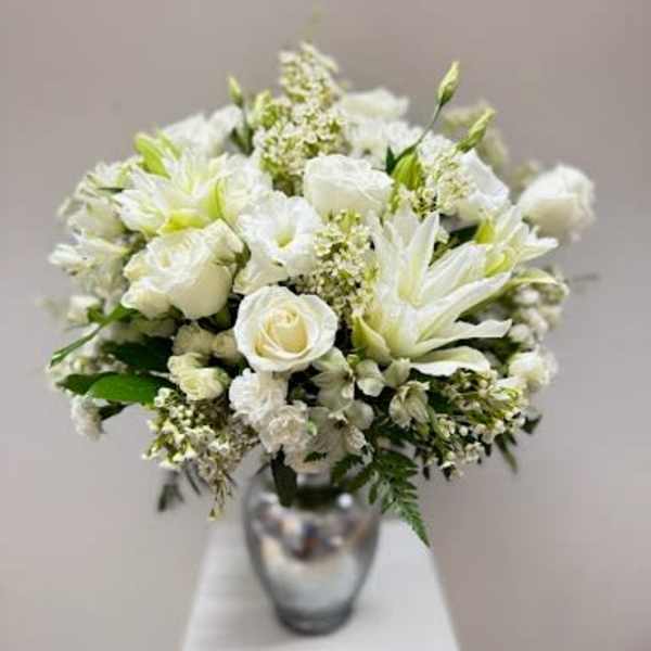 White floral bouquet in a silver vase