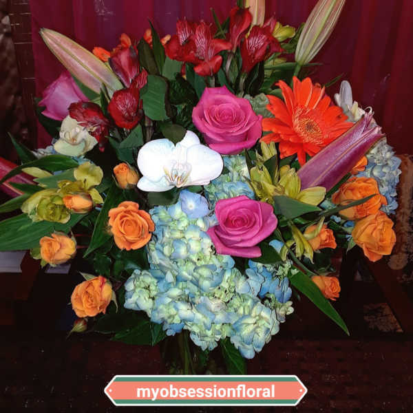 Mixed bouquet with roses, orchids, lilies, gerbera daisies, and hydrangeas