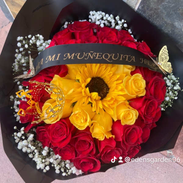 Bouquet of red and yellow roses with a sunflower and black wrap