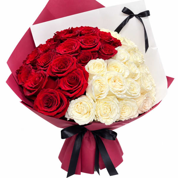 Bouquet of red and white roses wrapped in burgundy paper with a black ribbon