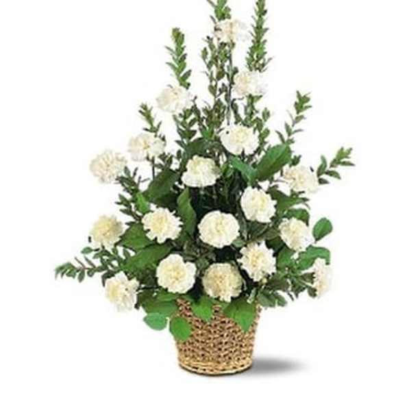 White carnation arrangement in a woven basket