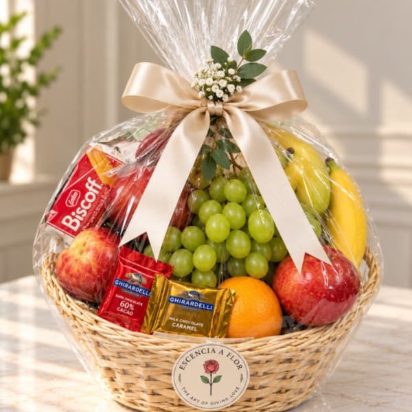 Fruit basket with grapes, apples, bananas, oranges, and chocolates in clear wrap