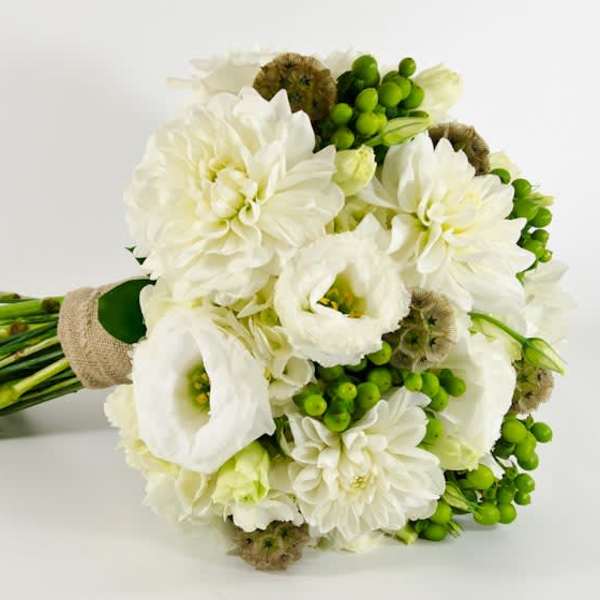 White bouquet with green berries and wrapped stems