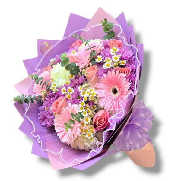 Bouquet of pink and purple flowers wrapped in lavender paper
