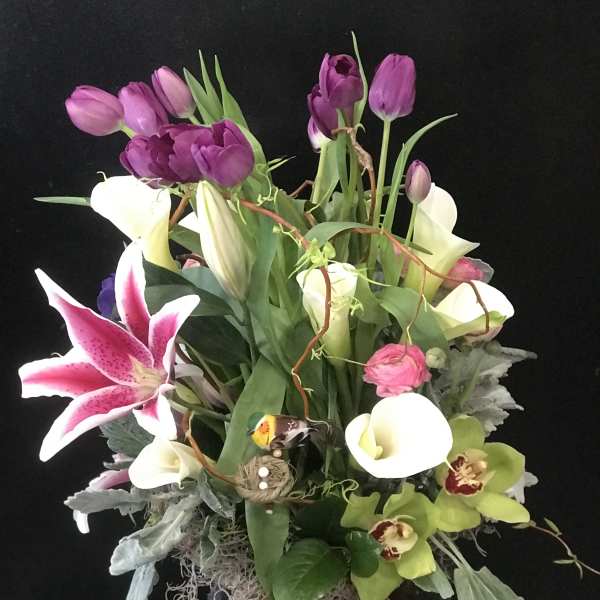 Mixed bouquet with purple tulips, white calla lilies, and pink stargazer lily