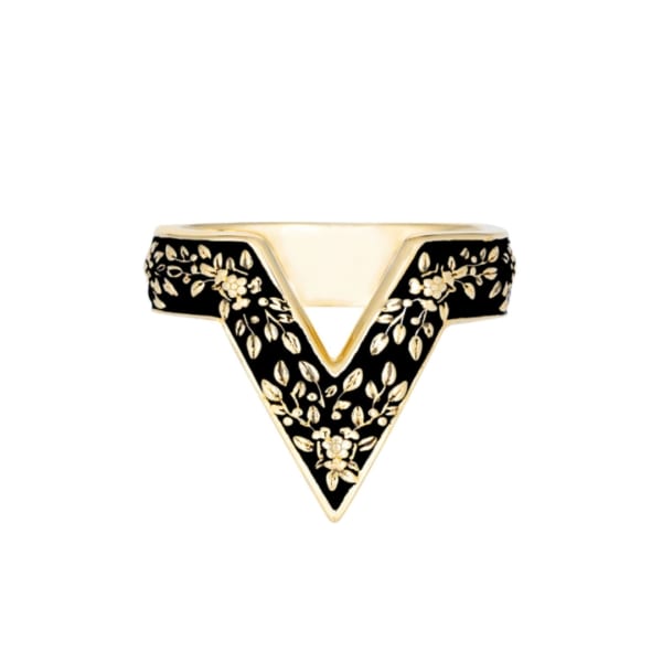 Black and gold floral-patterned ring with a pointed V-shaped design
