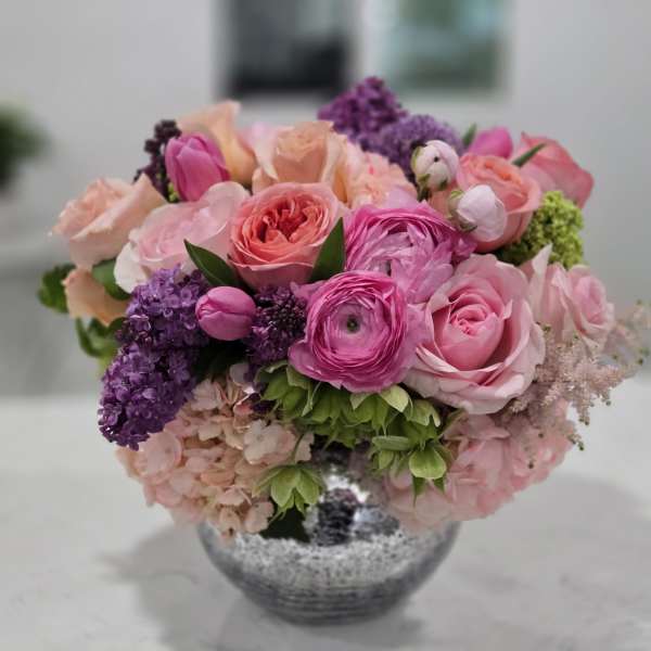 Pink and purple mixed bouquet in a silver vase