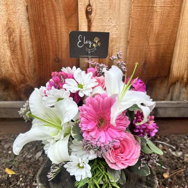 Pink and white mixed bouquet with lilies, daisies, and roses