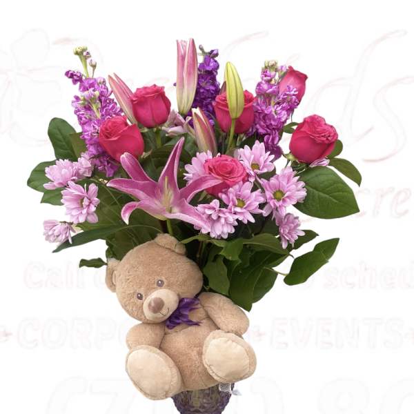 Pink and purple bouquet with a teddy bear attached
