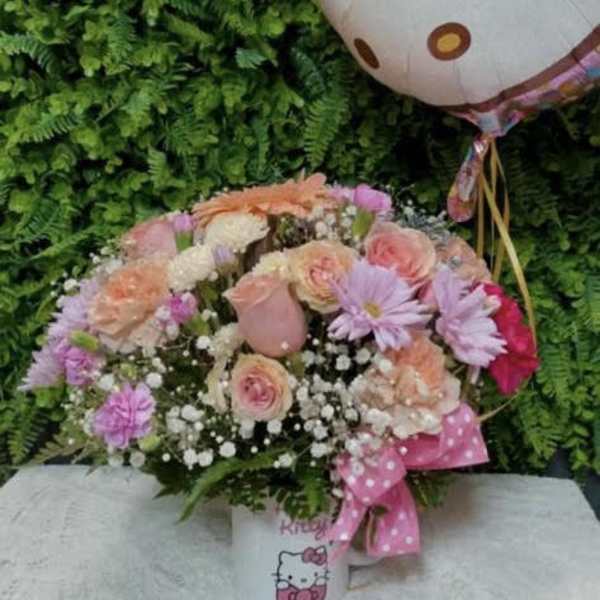 Mixed pink and peach bouquet with a Hello Kitty balloon