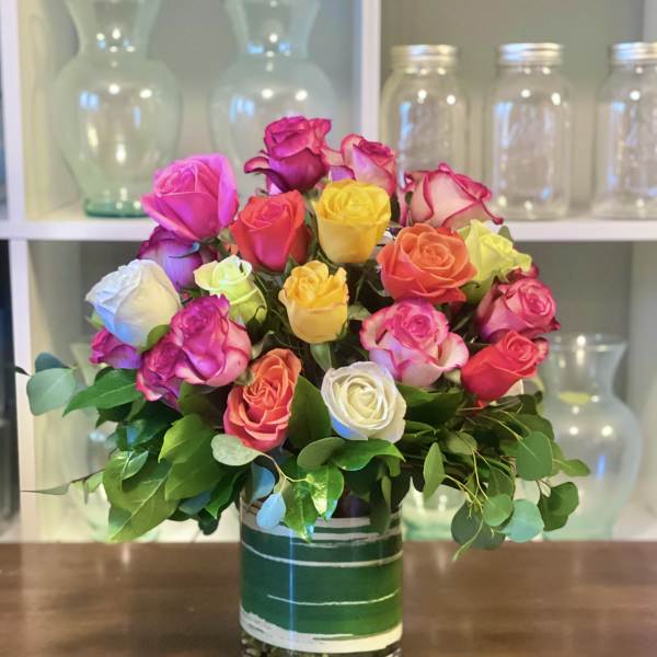 Colorful rose bouquet in a glass vase