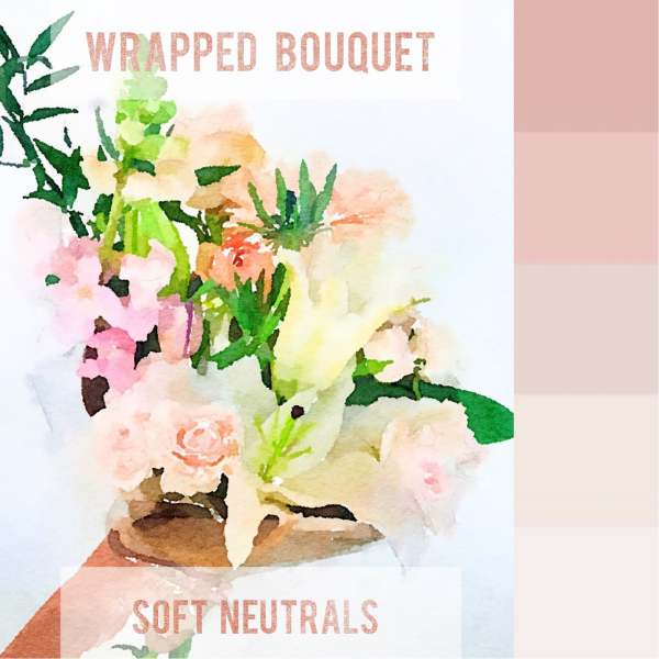 Wrapped bouquet of soft pastel flowers in blush, peach, and cream