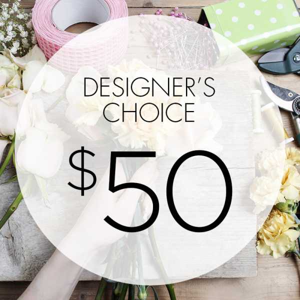 Designer’s choice floral arrangement with white blooms and craft supplies