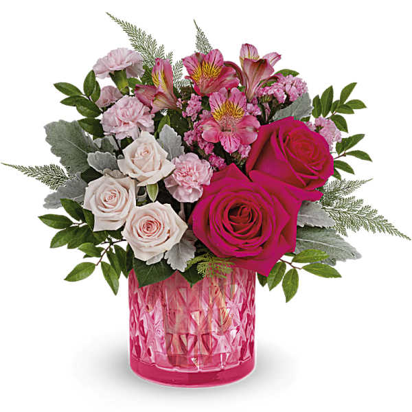 Pink and white mixed bouquet in a pink glass vase