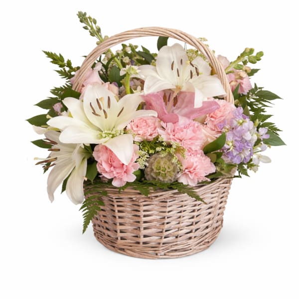 Basket of pink and white flowers with lilies and carnations