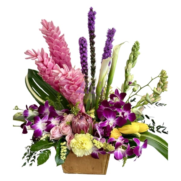 Mixed bouquet with purple orchids, pink flowers, and yellow tulips in a wooden box