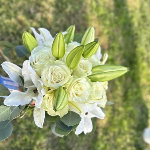 White rose and lily bouquet with green lily buds