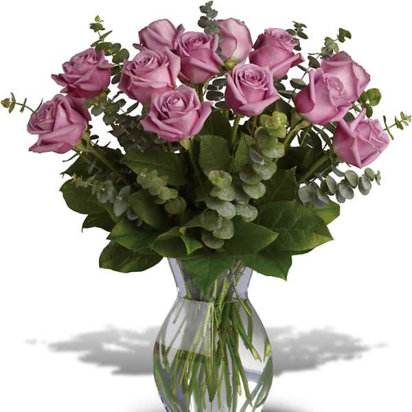 Pink roses arranged in a clear glass vase