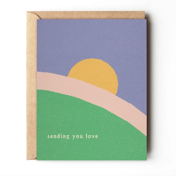 Greeting card with a pastel sunset design and the words "sending you love"