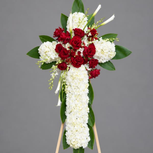 Standing floral cross with red roses and white flowers