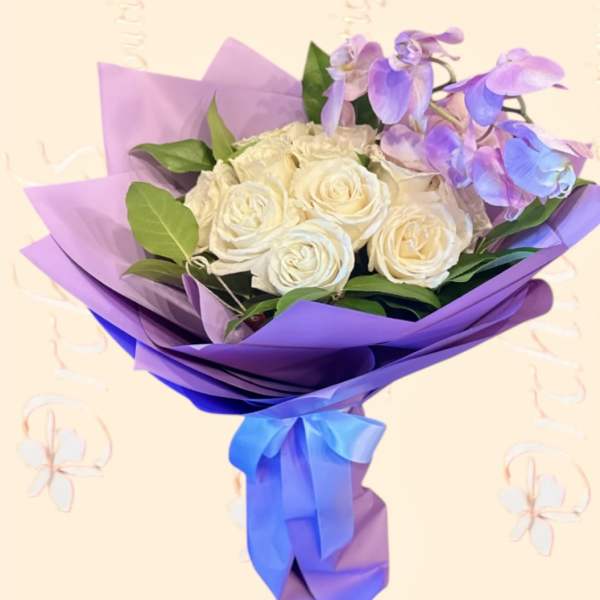 Bouquet of white roses and purple orchids wrapped in lavender paper