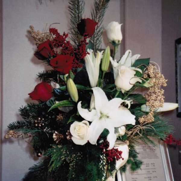 Tall floral standing spray with white lilies and red roses